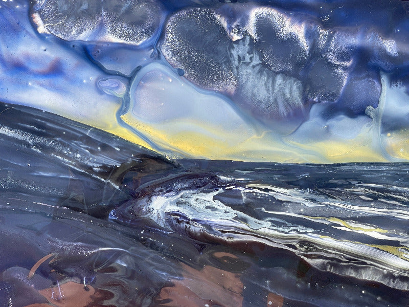 Abstract artwork featuring elements that could be interpreted as representing land, sea, and sky, with a blend of stormy blues, silvery purples, and soft gold.