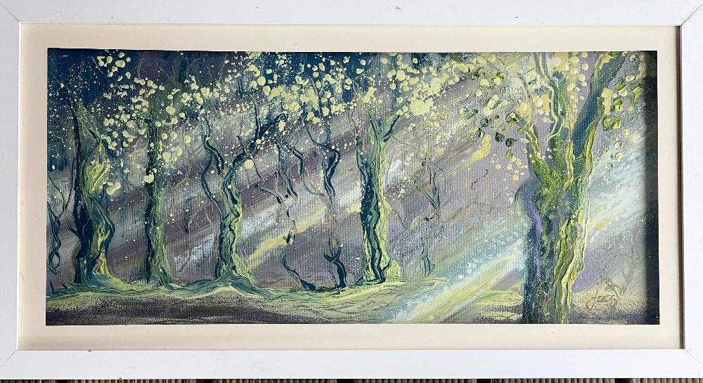 Framed artwork of a stylized forest scene with trees and a path.