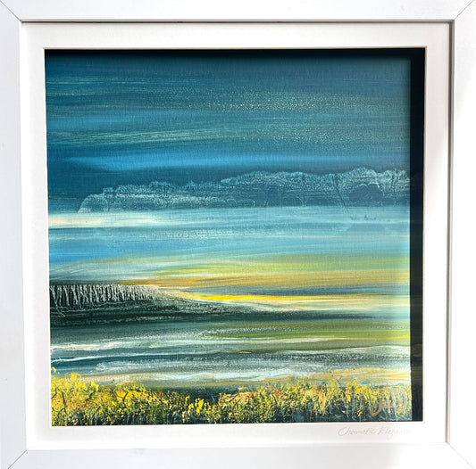 Framed abstract artwork with blue, green, and yellow colors